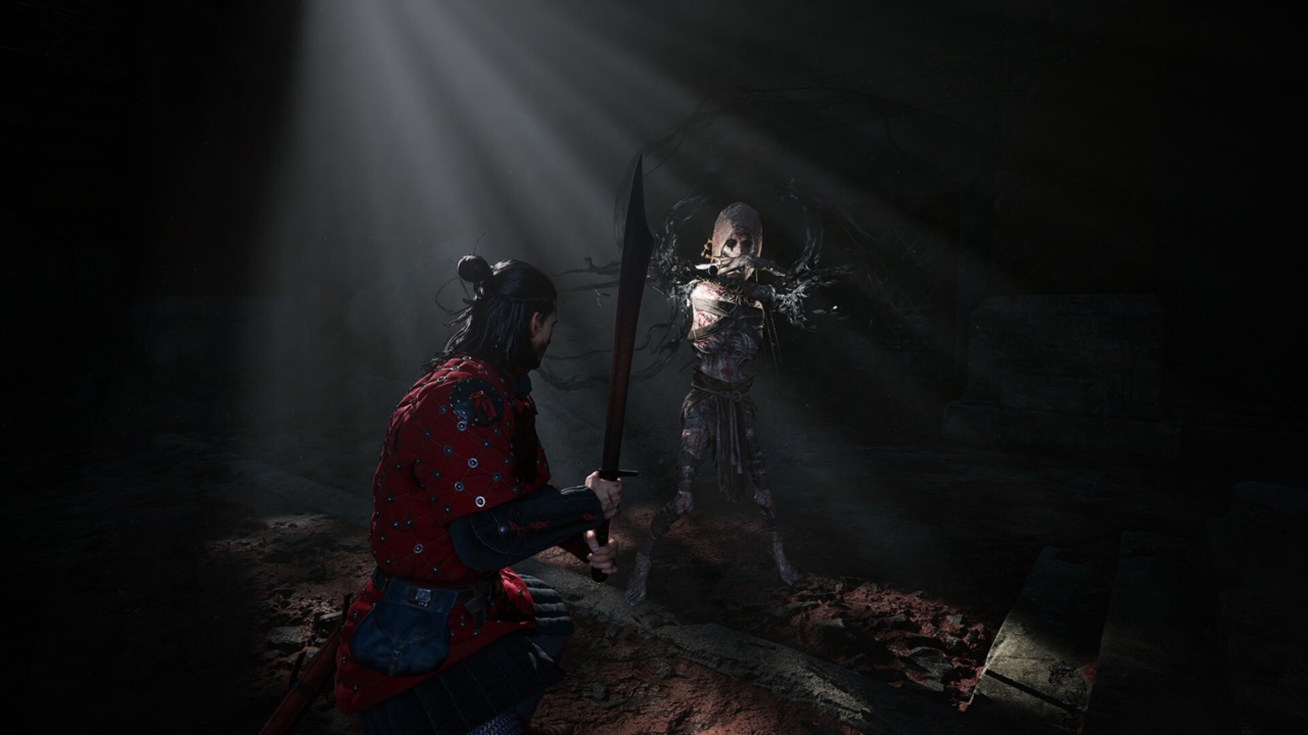 A dark cavern, Coen with a long blade facing a shadowy creature.